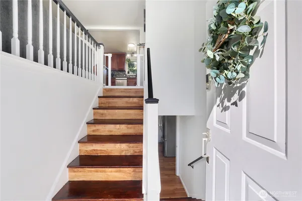 a view of entryway with wooden floor