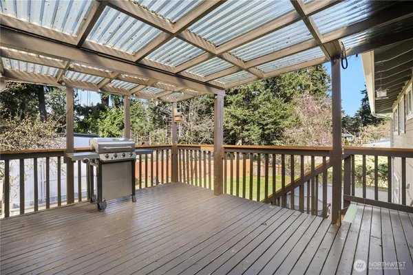 a view of porch with wooden floor