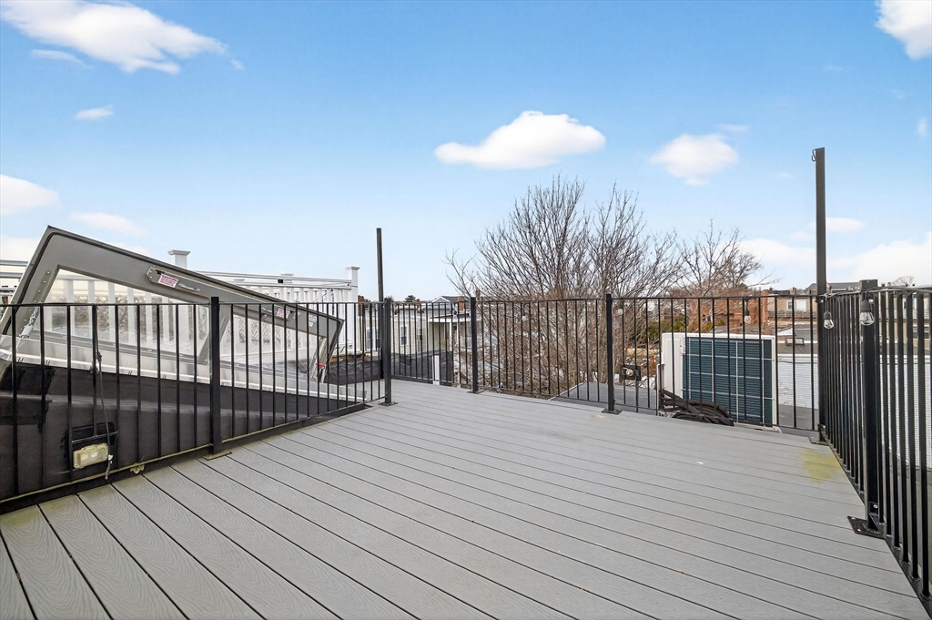 137 N Street, Unit 3 Boston, MA 02127 - Photo 21 of 28 a view of a balcony with wooden floor