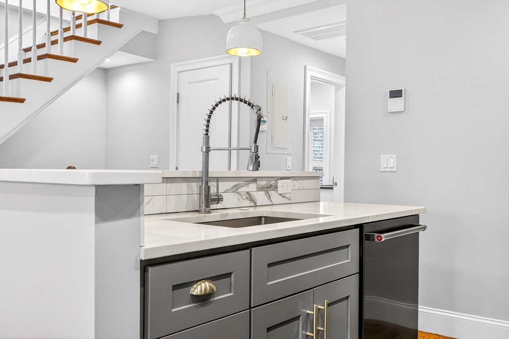 137 N Street, Unit 3 Boston, MA 02127 - Photo 5 of 28 a bathroom with a sink and a mirror