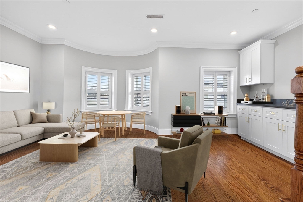 137 N Street, Unit 3 Boston, MA 02127 - Photo 7 of 28 a living room with furniture and kitchen view
