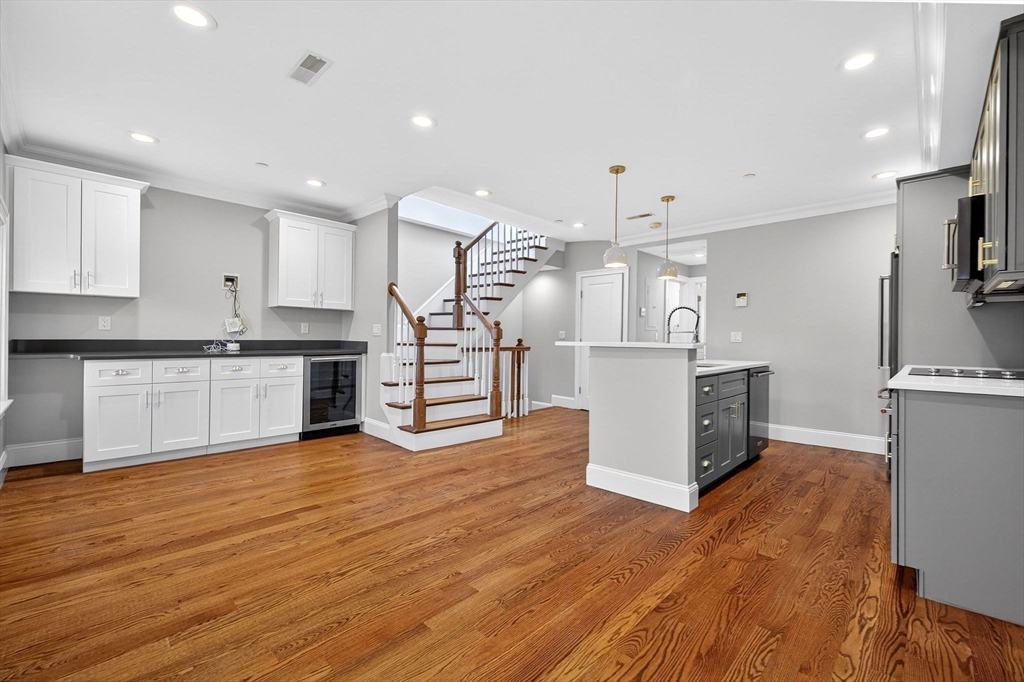 137 N Street, Unit 3 Boston, MA 02127 - Photo 8 of 28 a large kitchen with stainless steel appliances granite countertop a stove and a refrigerator