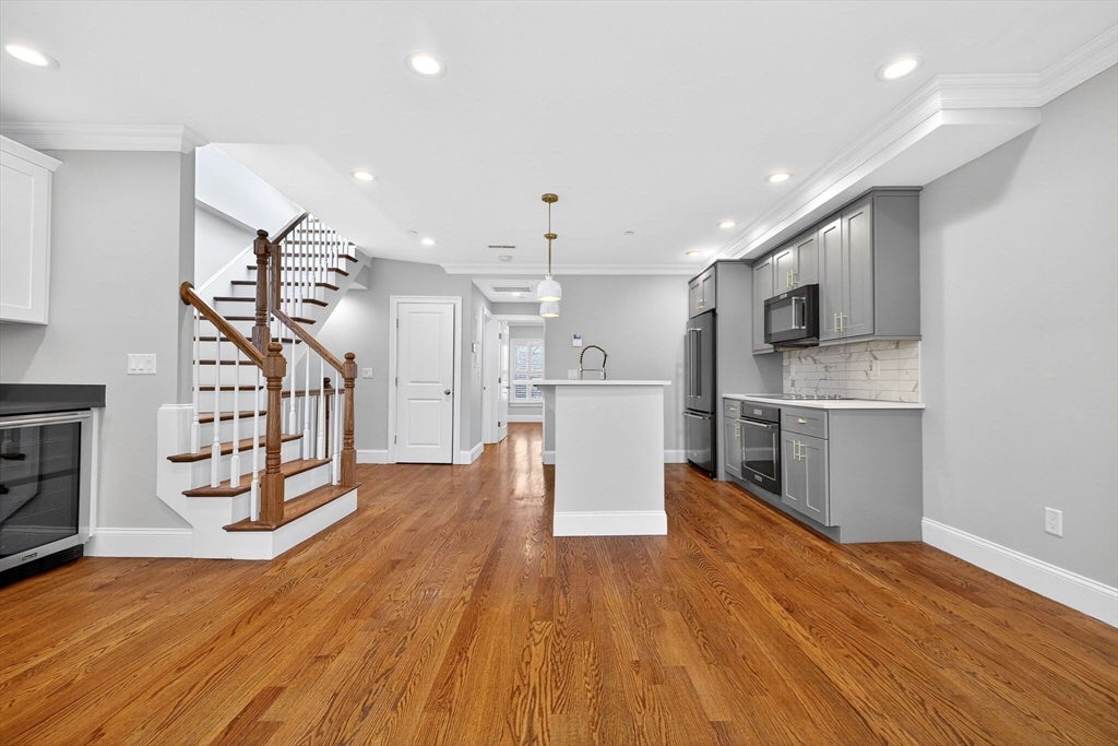 137 N Street, Unit 3 Boston, MA 02127 - Photo 9 of 28 a view of a kitchen with wooden floor and a kitchen