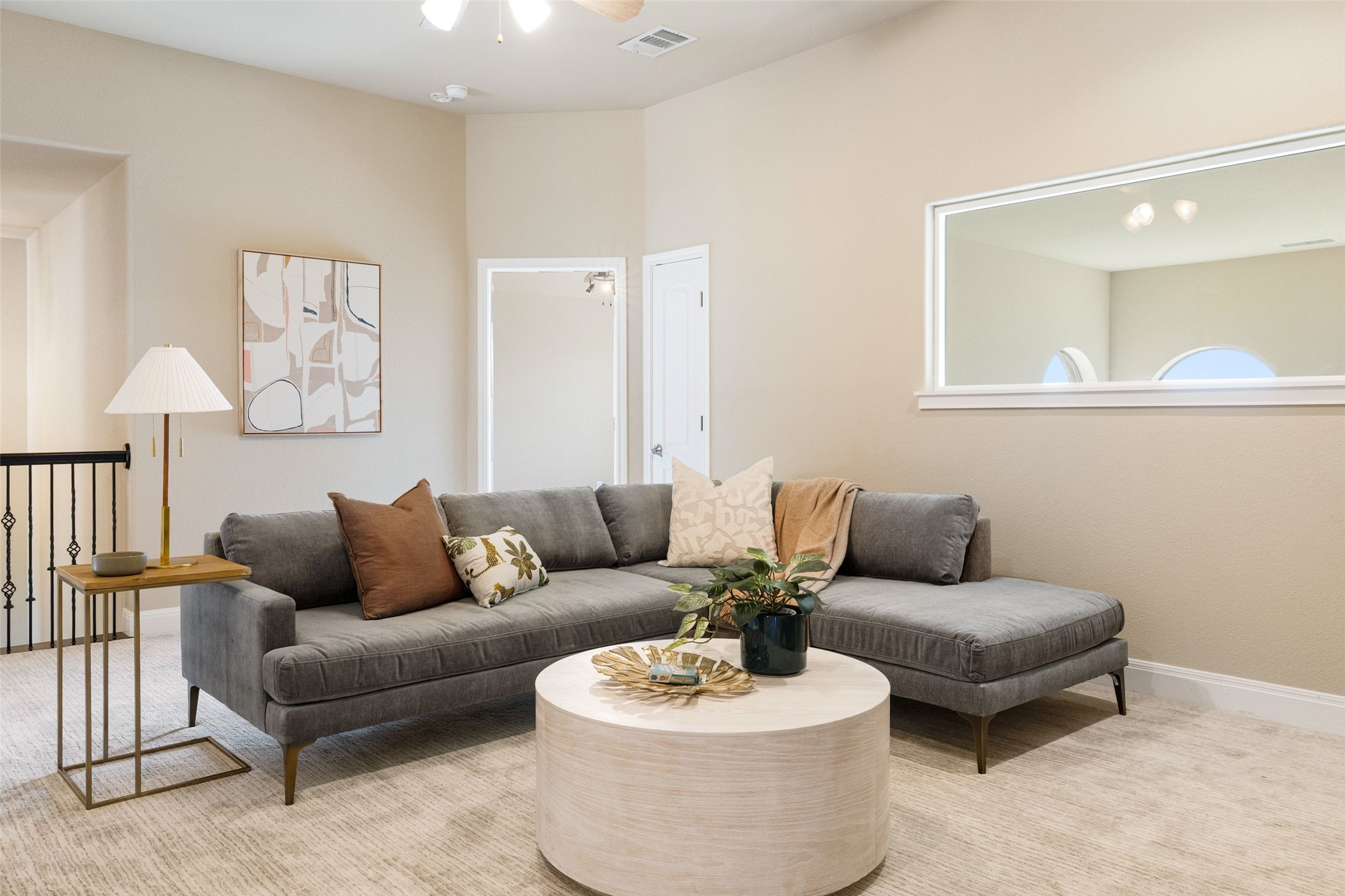 2702 Lakehurst Road Spicewood, TX 78669 - Photo 28 of 40 a living room with furniture and a wooden floor