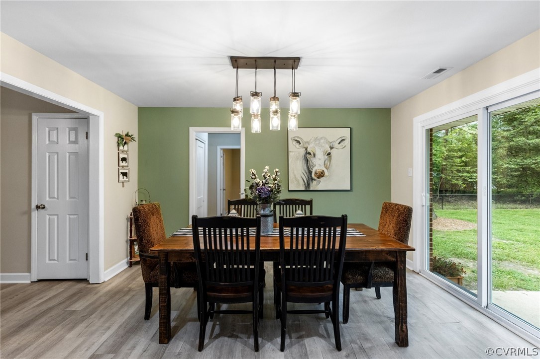 6286 McClellan Road Mechanicsville, VA 23111 - Photo 12 of 29 a view of a dining room with furniture window and wooden floor