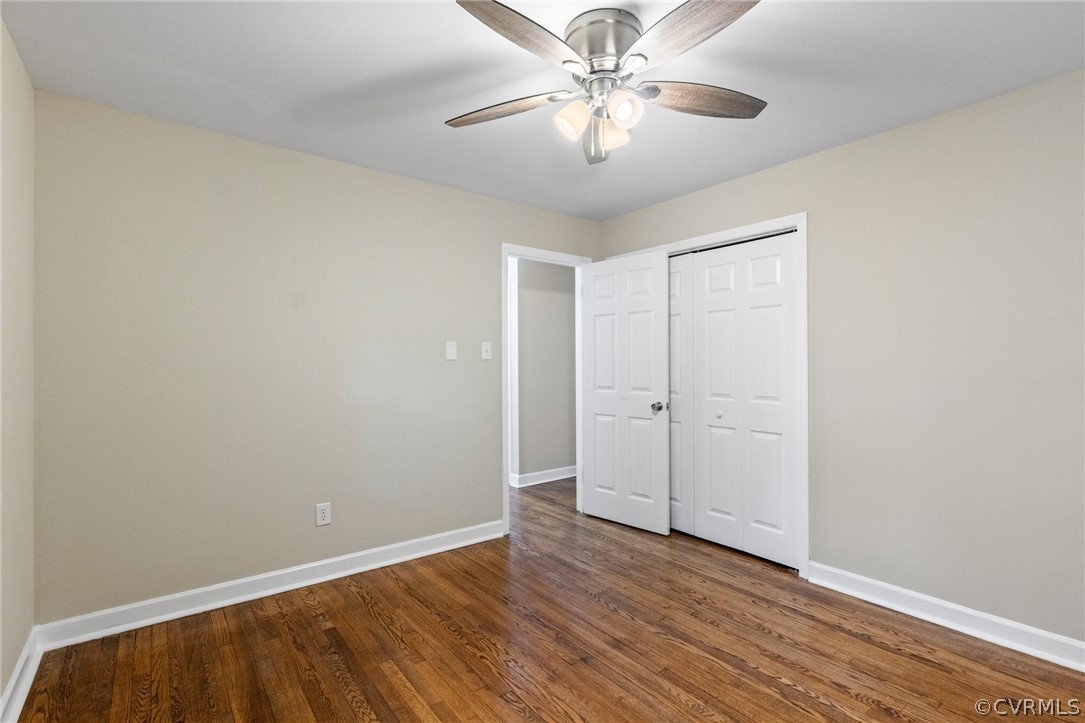 6286 McClellan Road Mechanicsville, VA 23111 - Photo 14 of 29 an empty room with wooden floor fan and windows