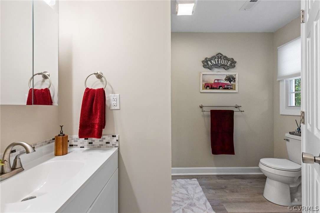 6286 McClellan Road Mechanicsville, VA 23111 - Photo 19 of 29 a bathroom with a sink and a mirror