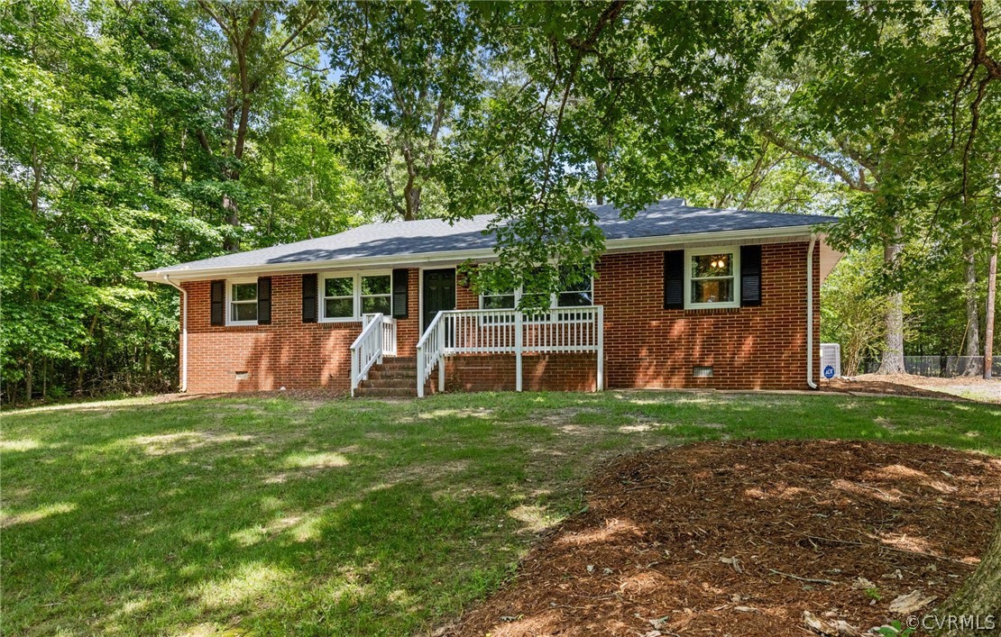 6286 McClellan Road Mechanicsville, VA 23111 - Photo 3 of 29 a view of a house with a yard