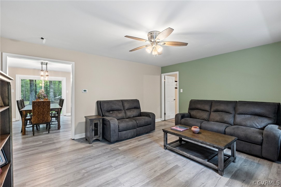 6286 McClellan Road Mechanicsville, VA 23111 - Photo 6 of 29 a living room with furniture ceiling fan and a wooden floor