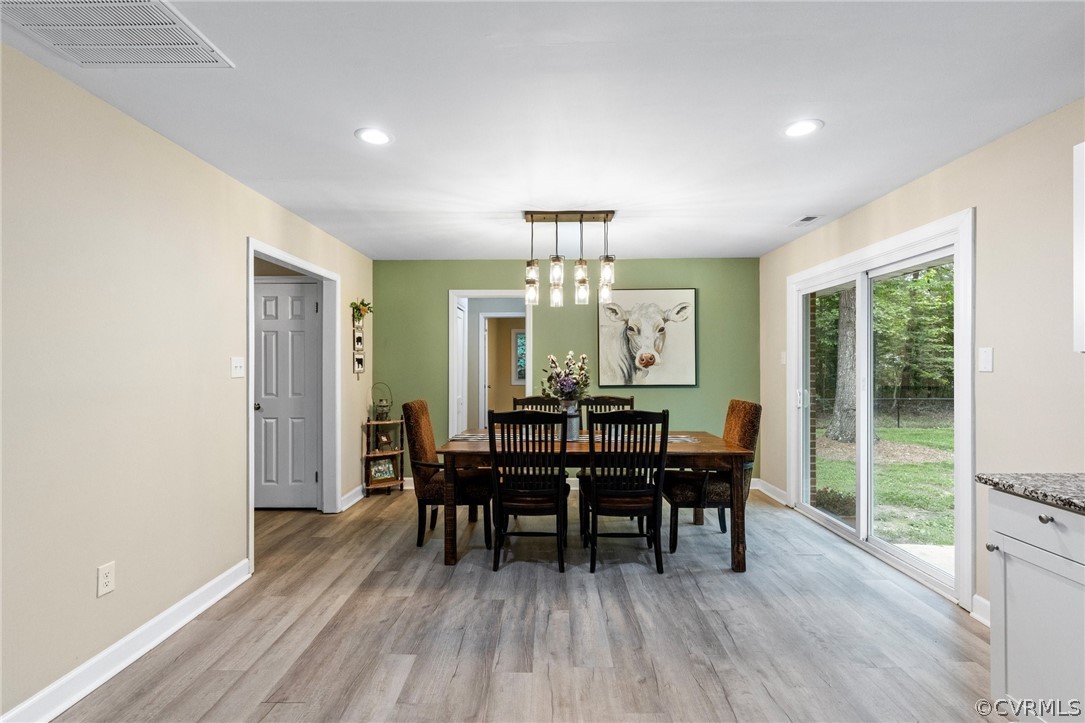 6286 McClellan Road Mechanicsville, VA 23111 - Photo 10 of 29 a view of a dining room with furniture window and wooden floor