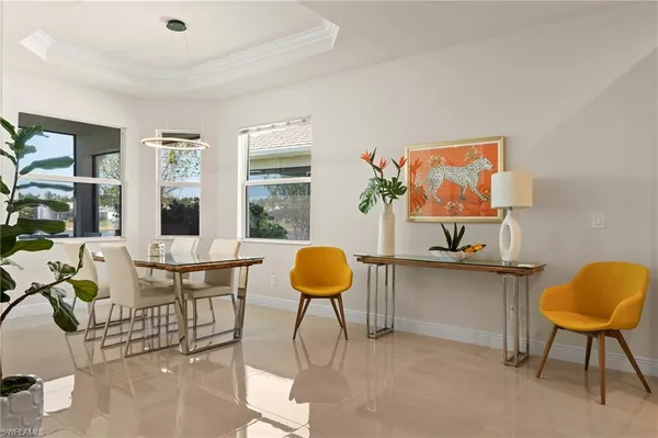a living room with furniture a rug and a window