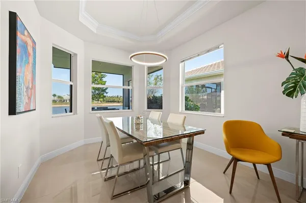 a dining room with furniture and window