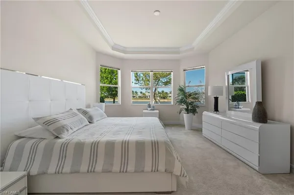 a spacious bedroom with a large bed and a couch