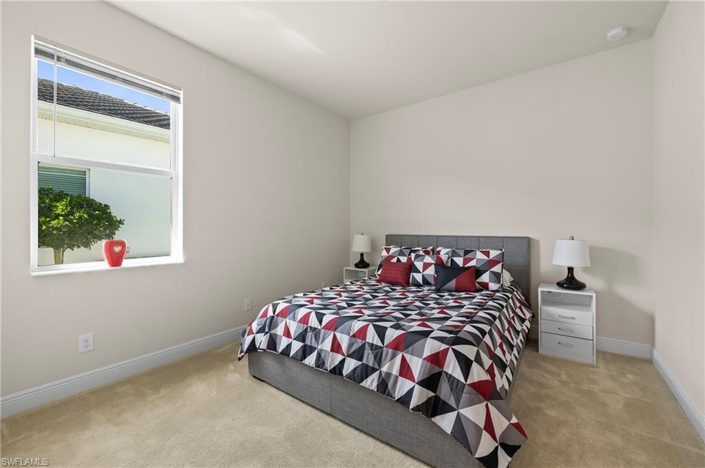 8897 Redonda Drive Naples, FL 34114 - Photo 24 of 42 Carpeted bedroom with baseboards