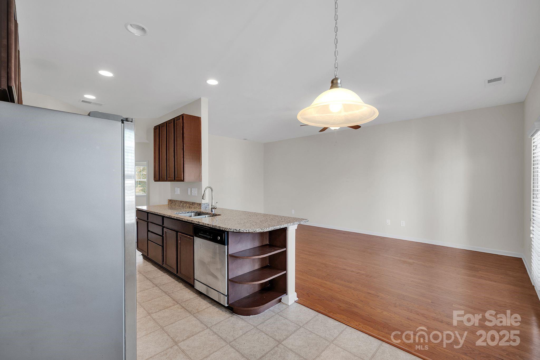 6439 Prosperity Church Road Charlotte, NC 28269 - Photo 13 of 46 a room with a table and chandelier