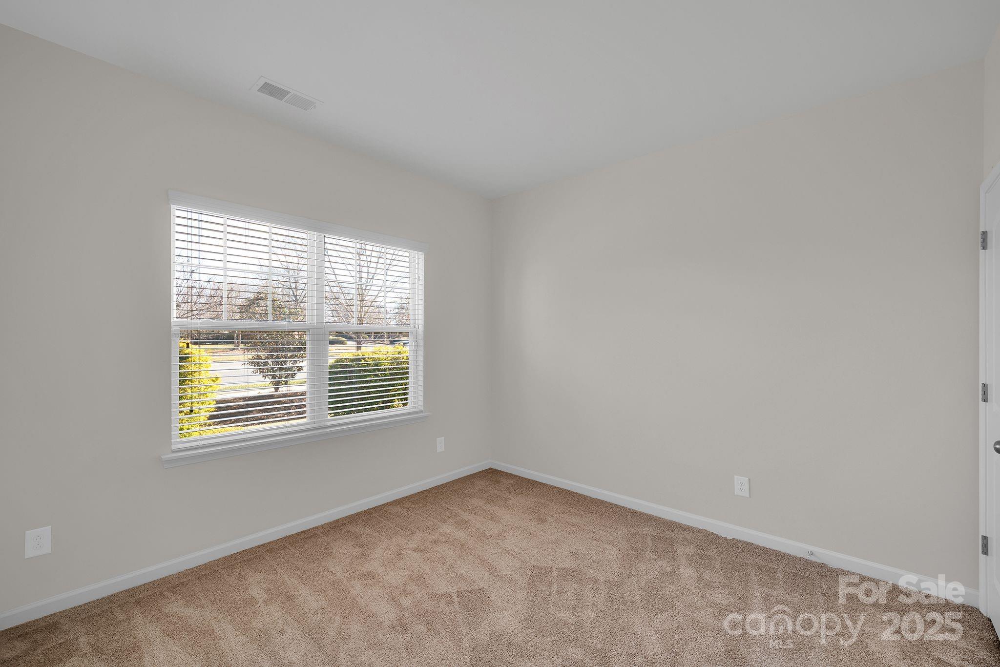 6439 Prosperity Church Road Charlotte, NC 28269 - Photo 20 of 46 an empty room with a window