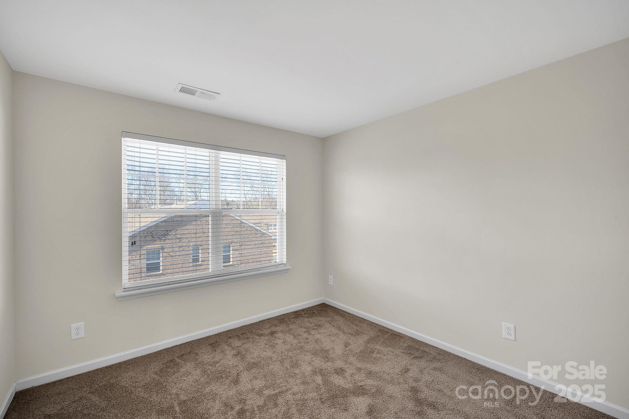 6439 Prosperity Church Road Charlotte, NC 28269 - Photo 25 of 46 an empty room with a window