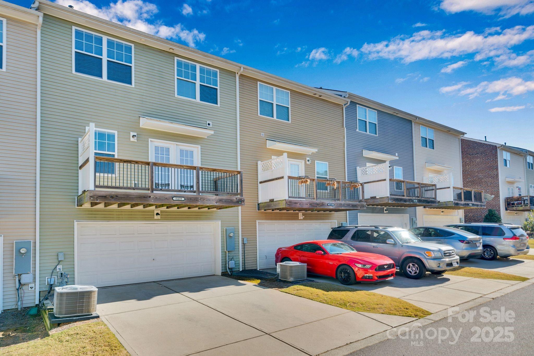 6439 Prosperity Church Road Charlotte, NC 28269 - Photo 39 of 46 a front view of a house with outdoor seating
