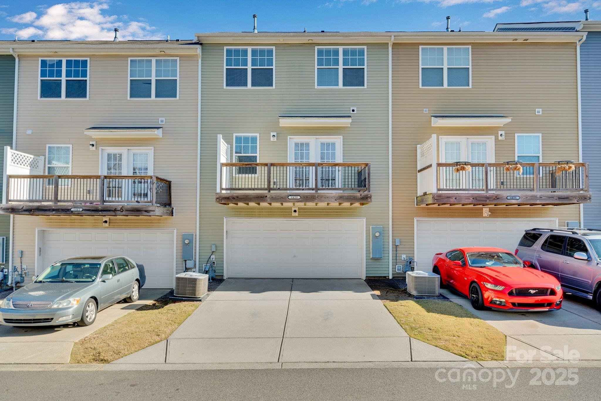 6439 Prosperity Church Road Charlotte, NC 28269 - Photo 40 of 46 a cars parked in front of a building