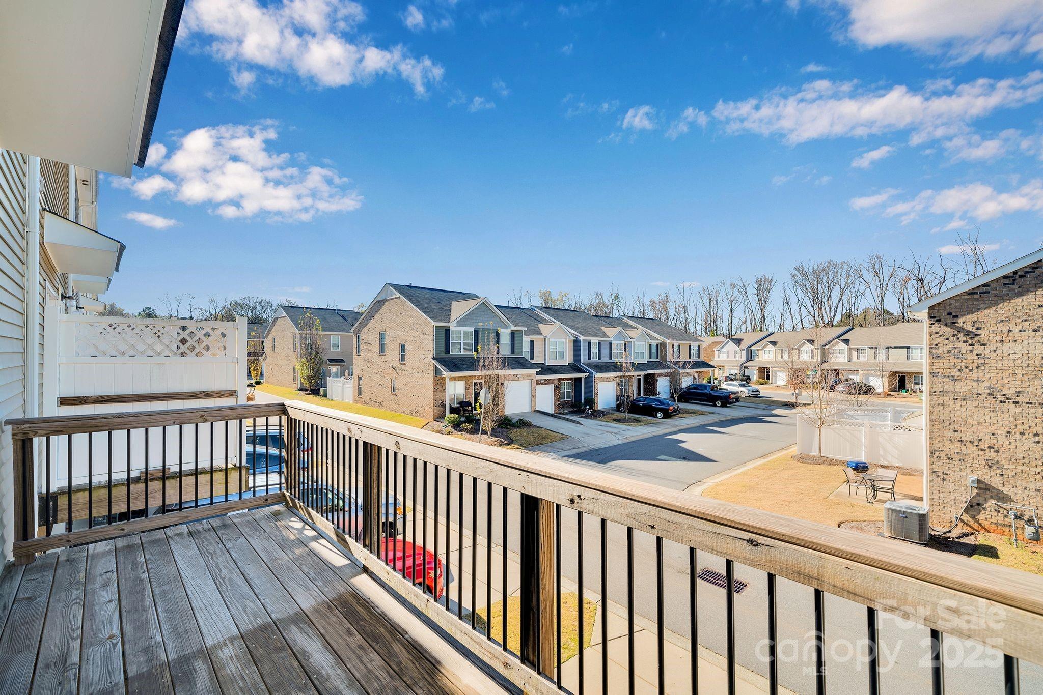 6439 Prosperity Church Road Charlotte, NC 28269 - Photo 10 of 46 a view of a balcony with wooden floor