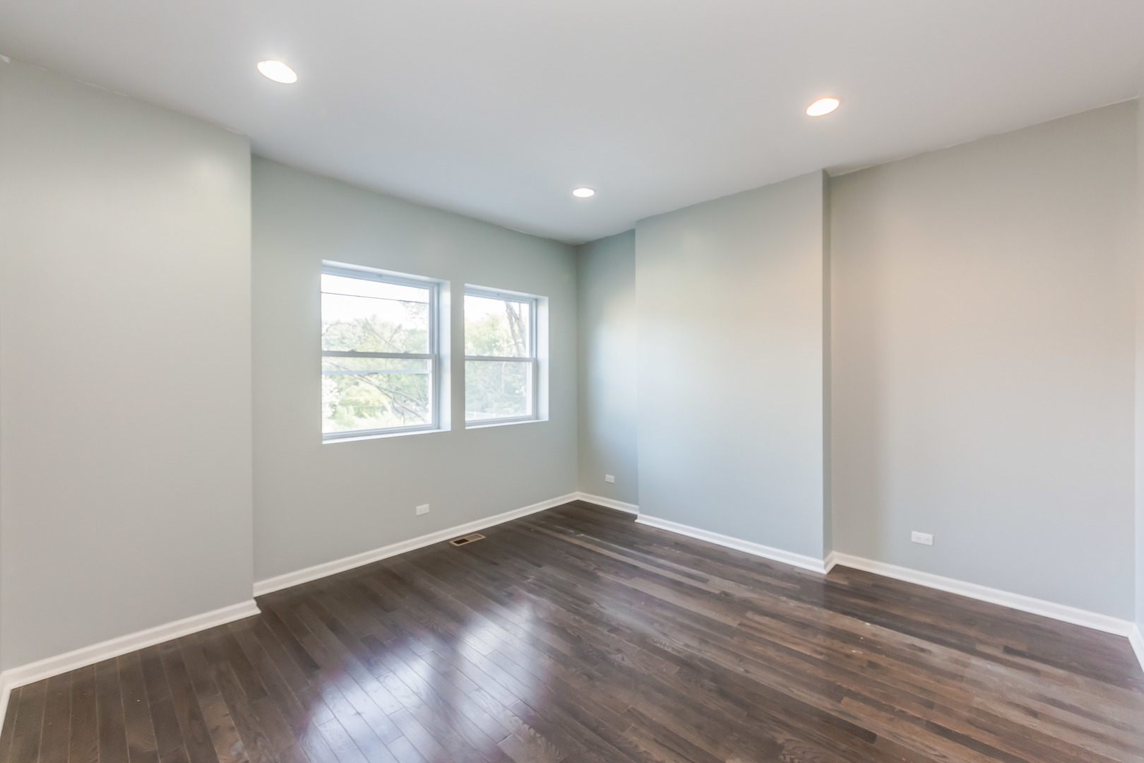 352 North Avers Avenue Chicago, IL 60624 - Photo 11 of 18 an empty room with wooden floor and windows