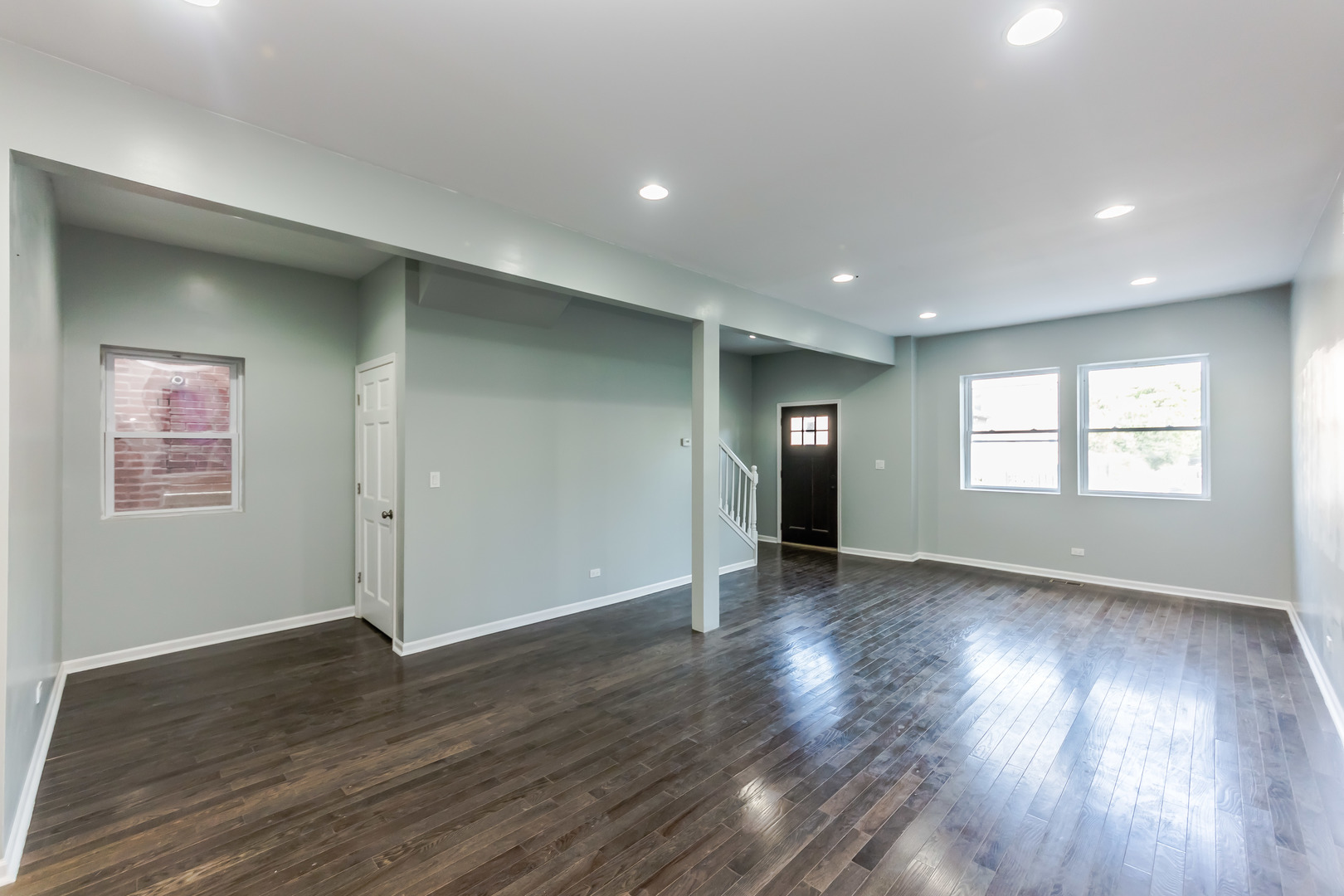 352 North Avers Avenue Chicago, IL 60624 - Photo 4 of 18 a view of an empty room with wooden floor and a window
