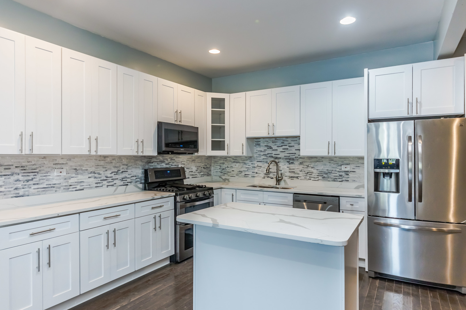 352 North Avers Avenue Chicago, IL 60624 - Photo 5 of 18 a kitchen with appliances a sink and a refrigerator