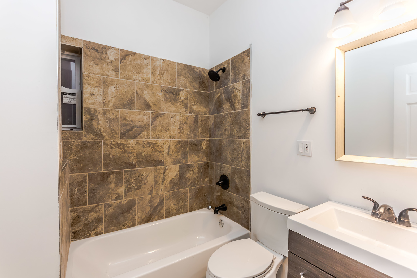 352 North Avers Avenue Chicago, IL 60624 - Photo 9 of 18 a bathroom with a sink toilet and shower
