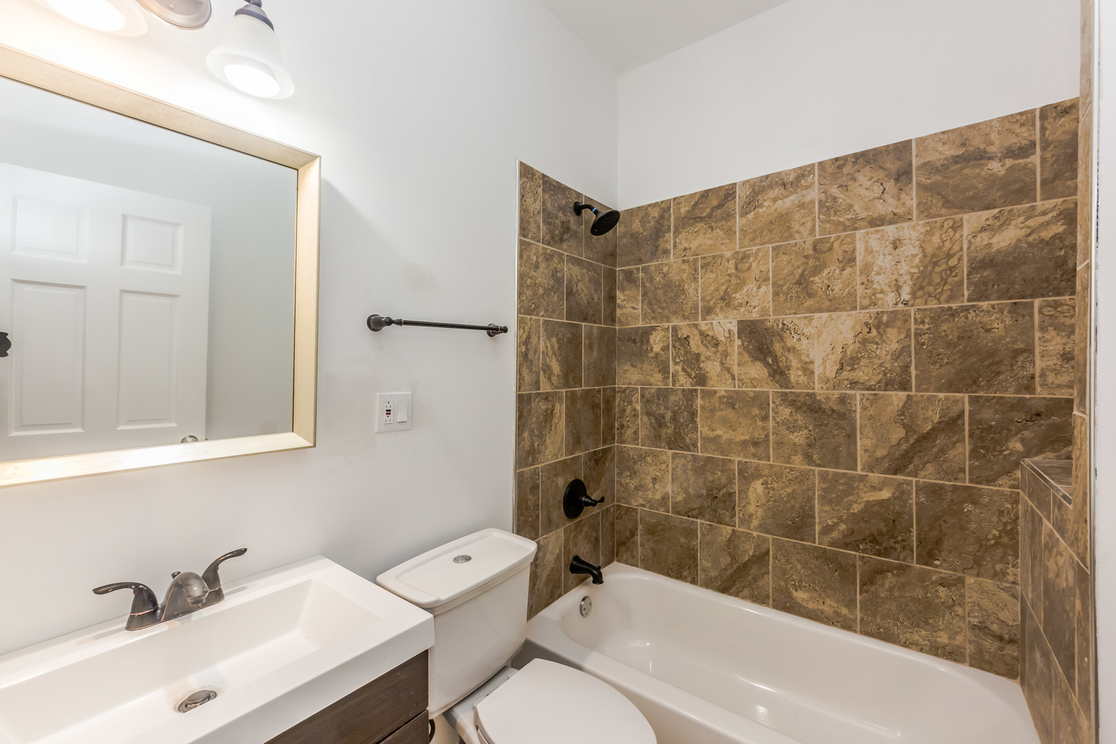 352 North Avers Avenue Chicago, IL 60624 - Photo 10 of 18 a bathroom with a sink and a bathtub