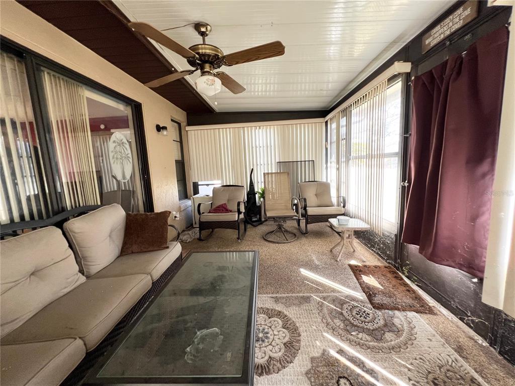 2918 West Campbell Road Lakeland, FL 33810 - Photo 3 of 10 a living room with furniture and a large window