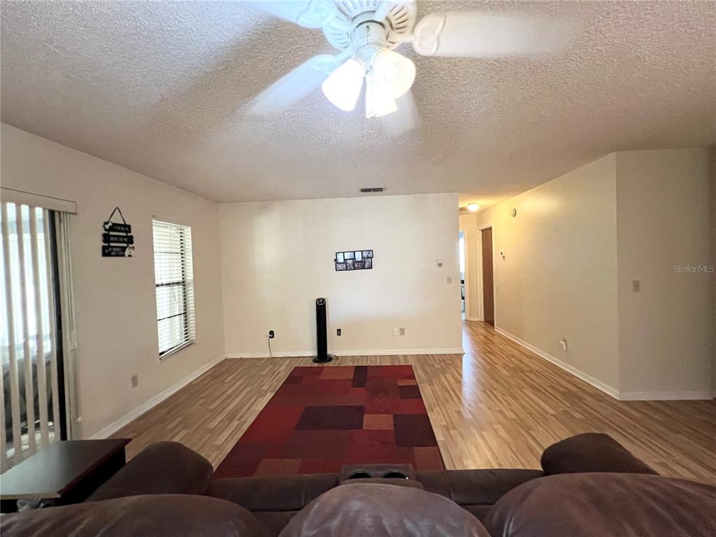 2918 West Campbell Road Lakeland, FL 33810 - Photo 4 of 10 a living room with furniture and a window
