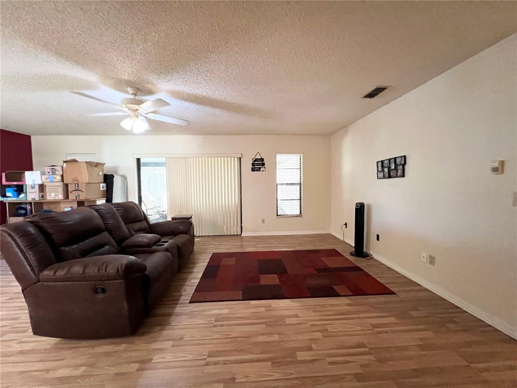 2918 West Campbell Road Lakeland, FL 33810 - Photo 5 of 10 a living room with furniture and a window