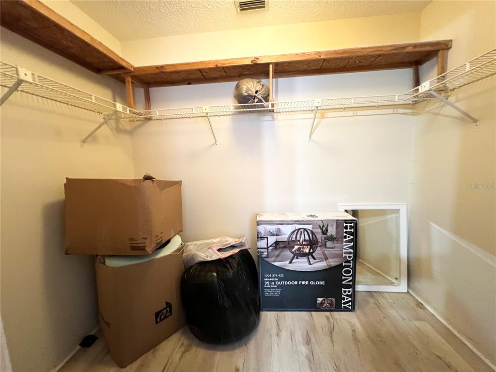 2918 West Campbell Road Lakeland, FL 33810 - Photo 9 of 10 a bed room with a bed and a table