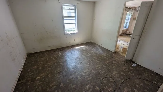 an empty room with windows