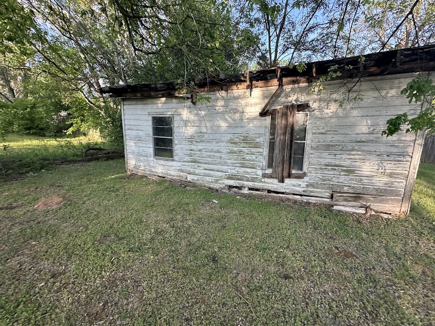 2319 Luther Street Tyler, TX 75701 - Photo 10 of 10 a backyard of a house with lots of green space