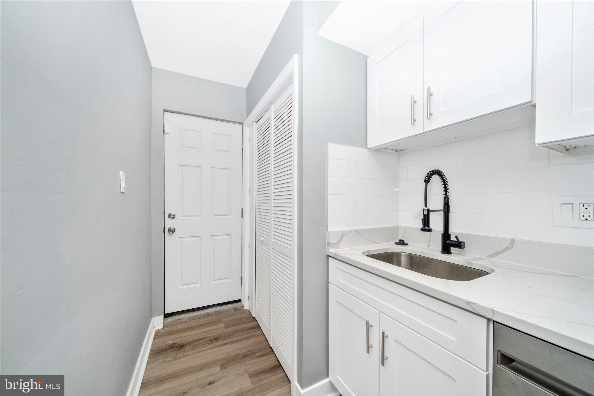 5027 Benning Road Southeast Washington, DC 20019 - Photo 19 of 57 a close view of a sink and cabinets in it