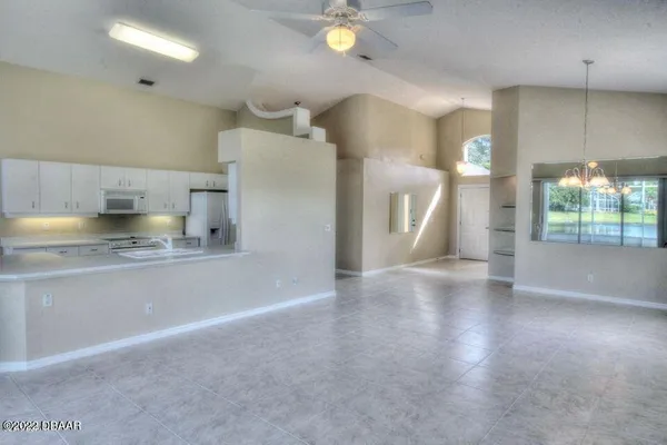 a kitchen with stainless steel appliances a refrigerator and a sink