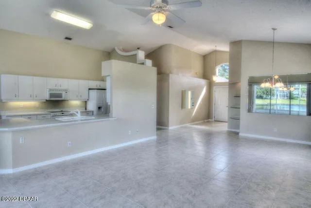 a kitchen with stainless steel appliances a refrigerator and a sink