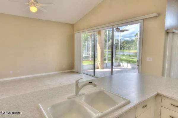 a bathroom with a sink and a large window