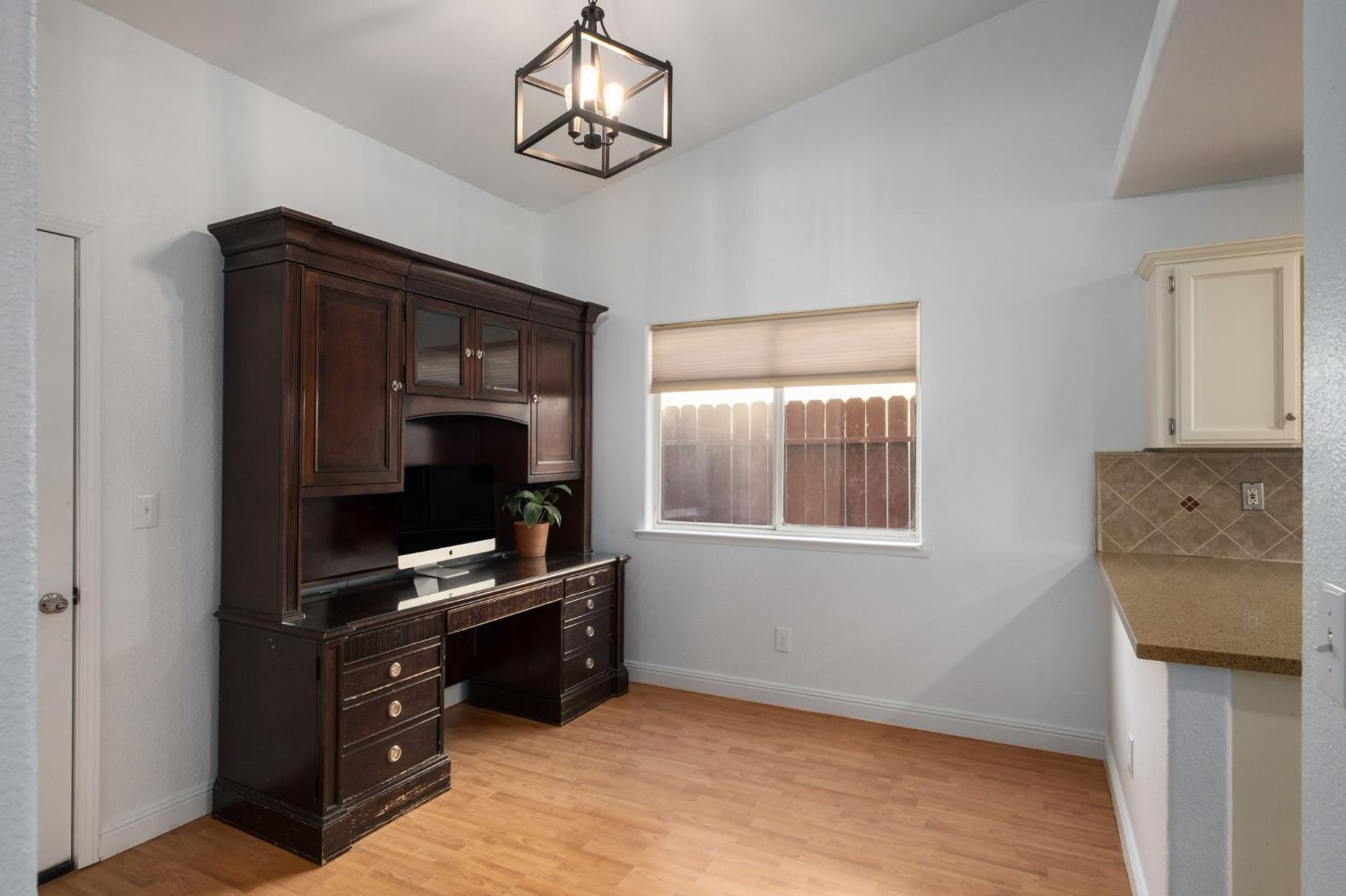 372 Lily Avenue Sanger, CA 93657 - Photo 12 of 30 a view of workspace with furniture and flat screen tv