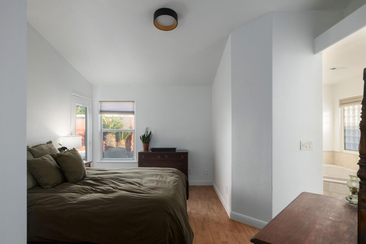 372 Lily Avenue Sanger, CA 93657 - Photo 13 of 30 a bedroom with a bed and a window