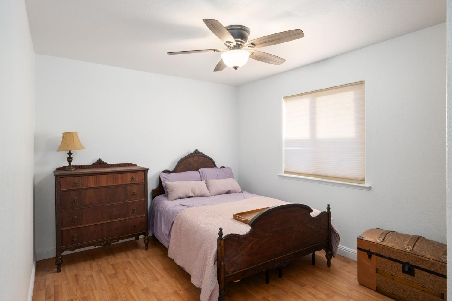 372 Lily Avenue Sanger, CA 93657 - Photo 17 of 30 a bedroom with a bed and a couch