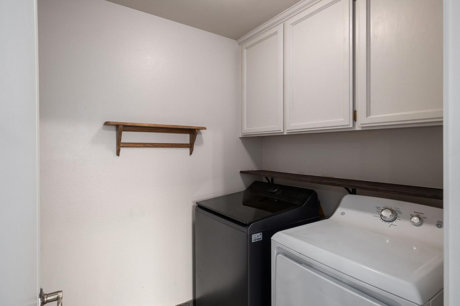 372 Lily Avenue Sanger, CA 93657 - Photo 22 of 30 a view of storage and utility room with washer and dryer
