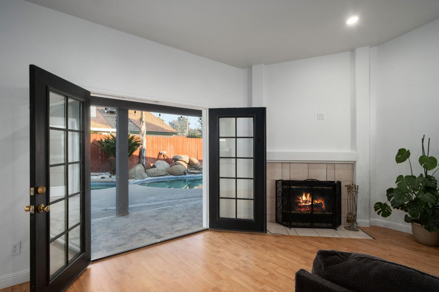 372 Lily Avenue Sanger, CA 93657 - Photo 23 of 30 a living room with furniture and a fireplace