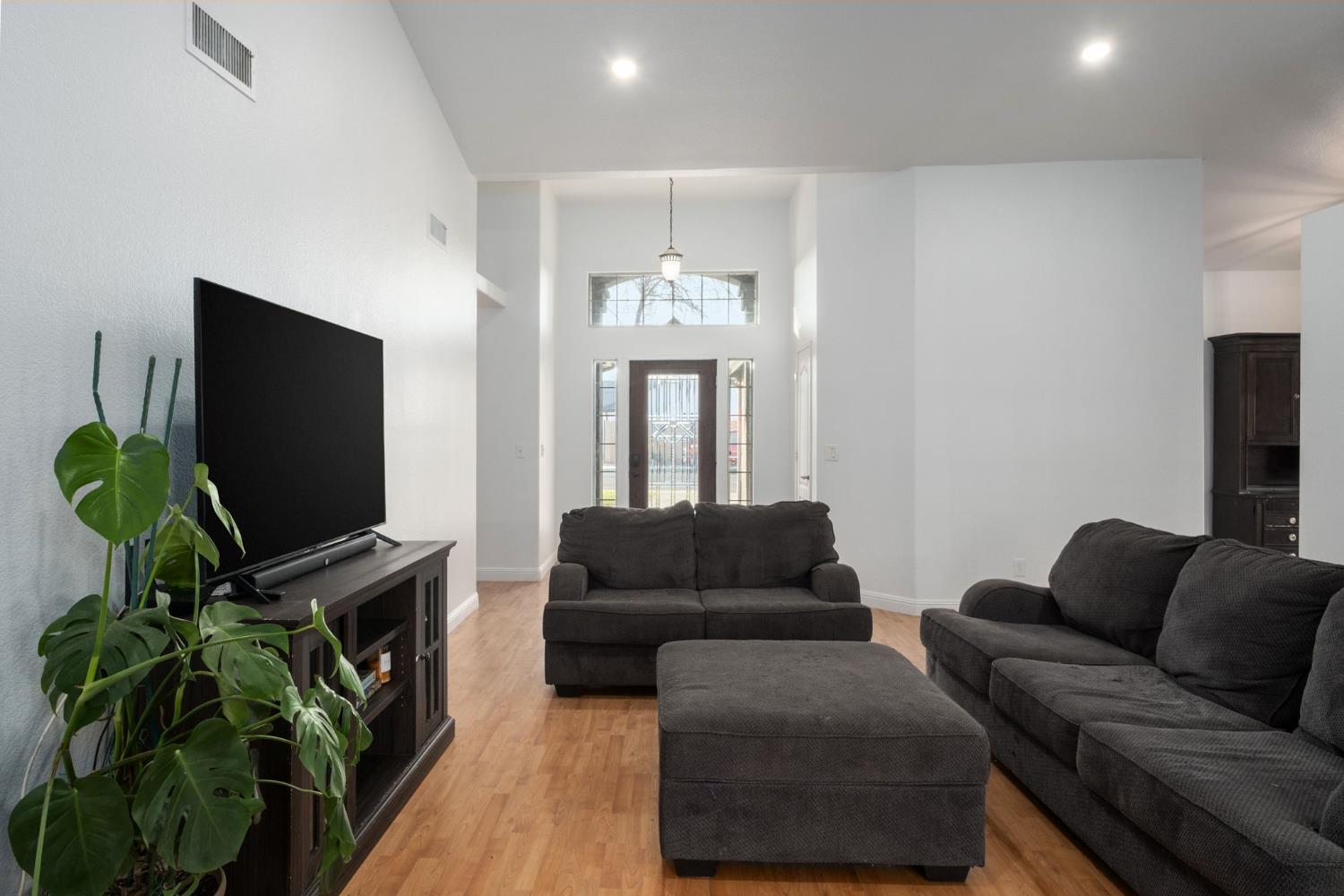 372 Lily Avenue Sanger, CA 93657 - Photo 7 of 30 a living room with furniture and a flat screen tv