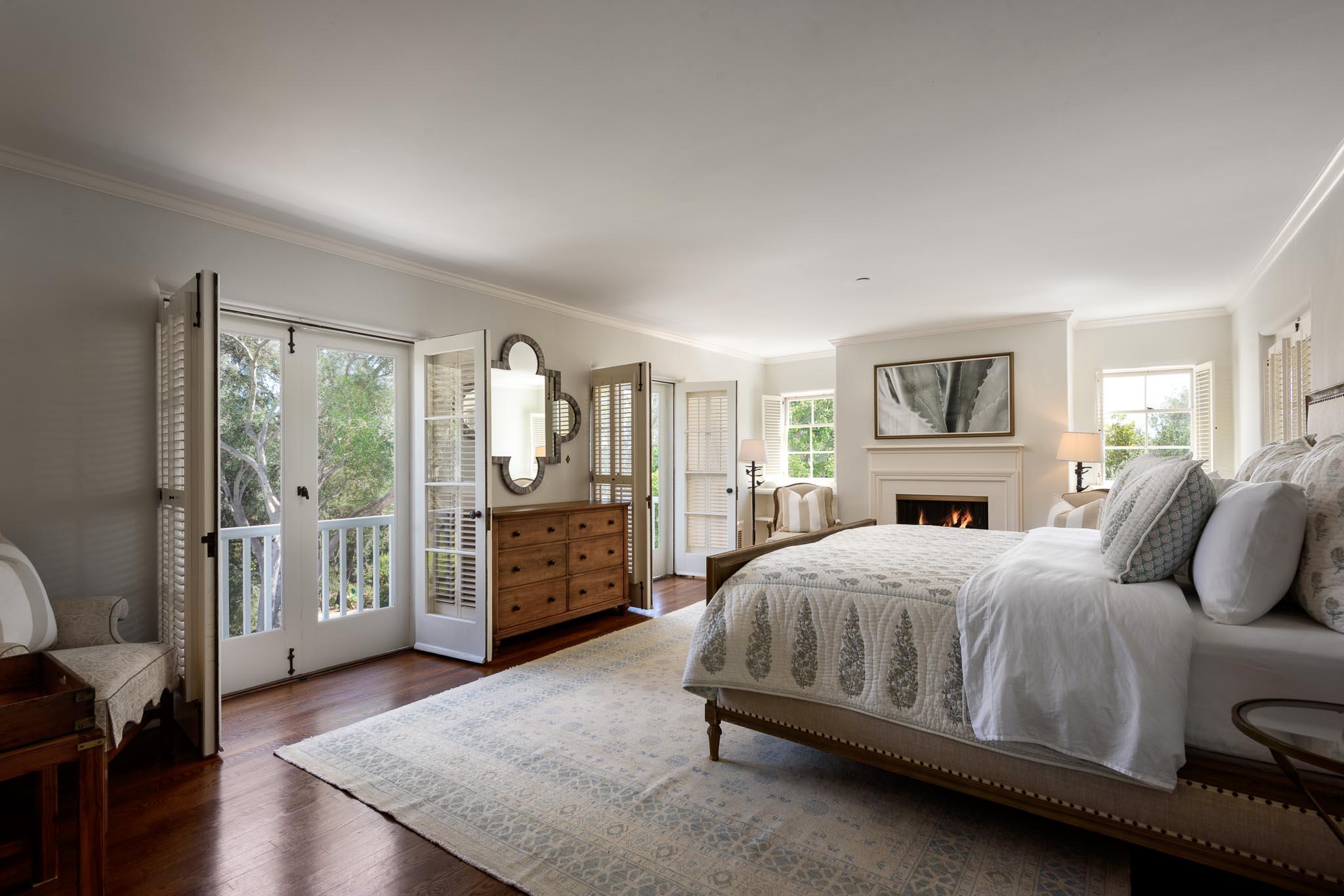 645-675 Olive Road Montecito, CA 93108 - Photo 13 of 34 a bedroom with a large bed and wooden floor