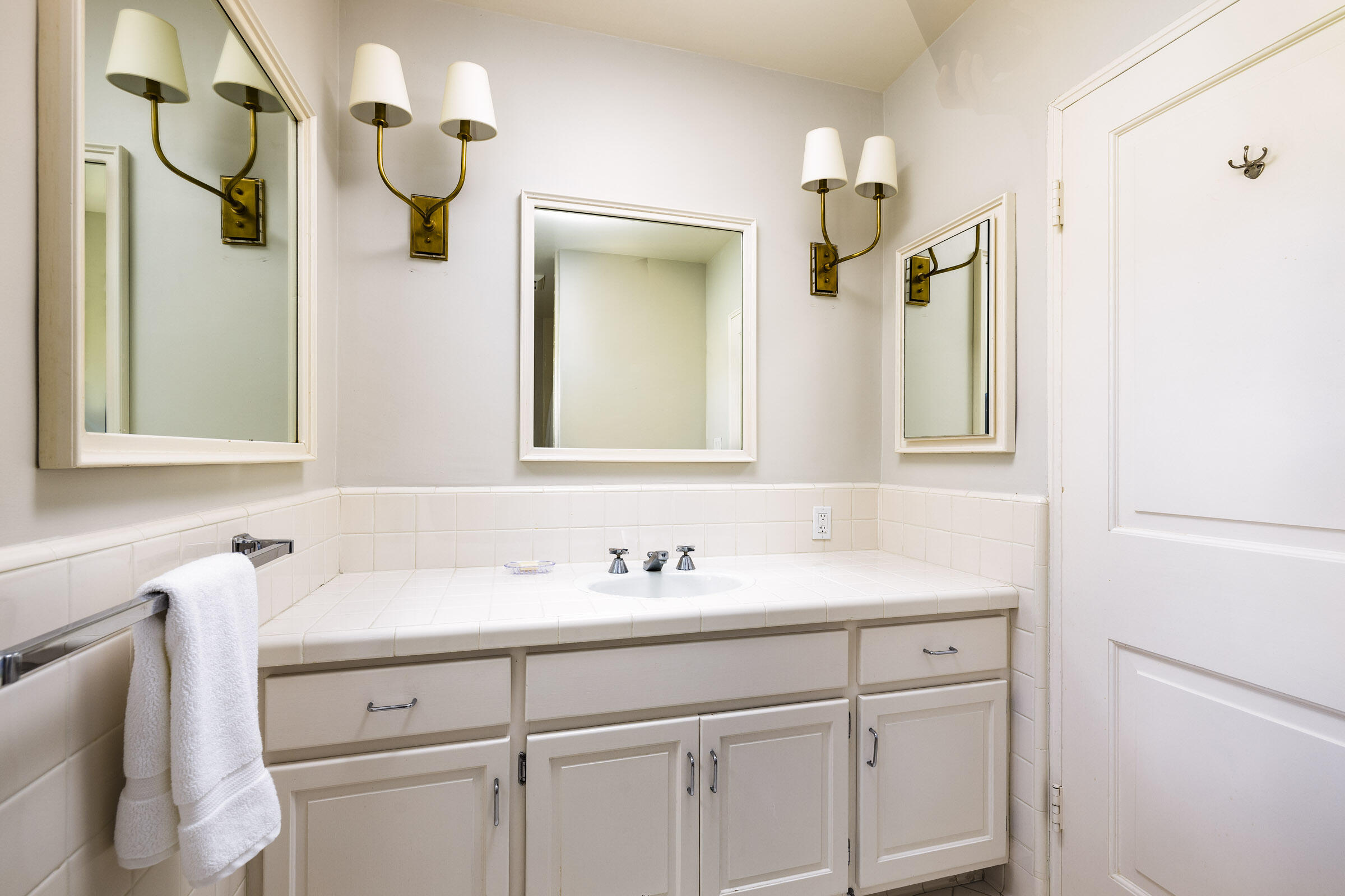 645-675 Olive Road Montecito, CA 93108 - Photo 14 of 34 a bathroom with a sink and a mirror