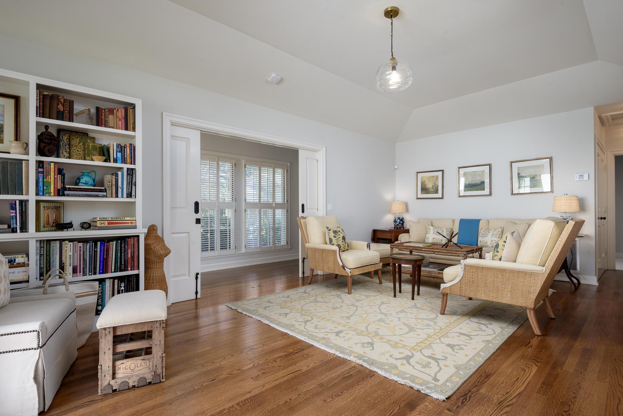 645-675 Olive Road Montecito, CA 93108 - Photo 15 of 34 a living room with furniture and a book shelf