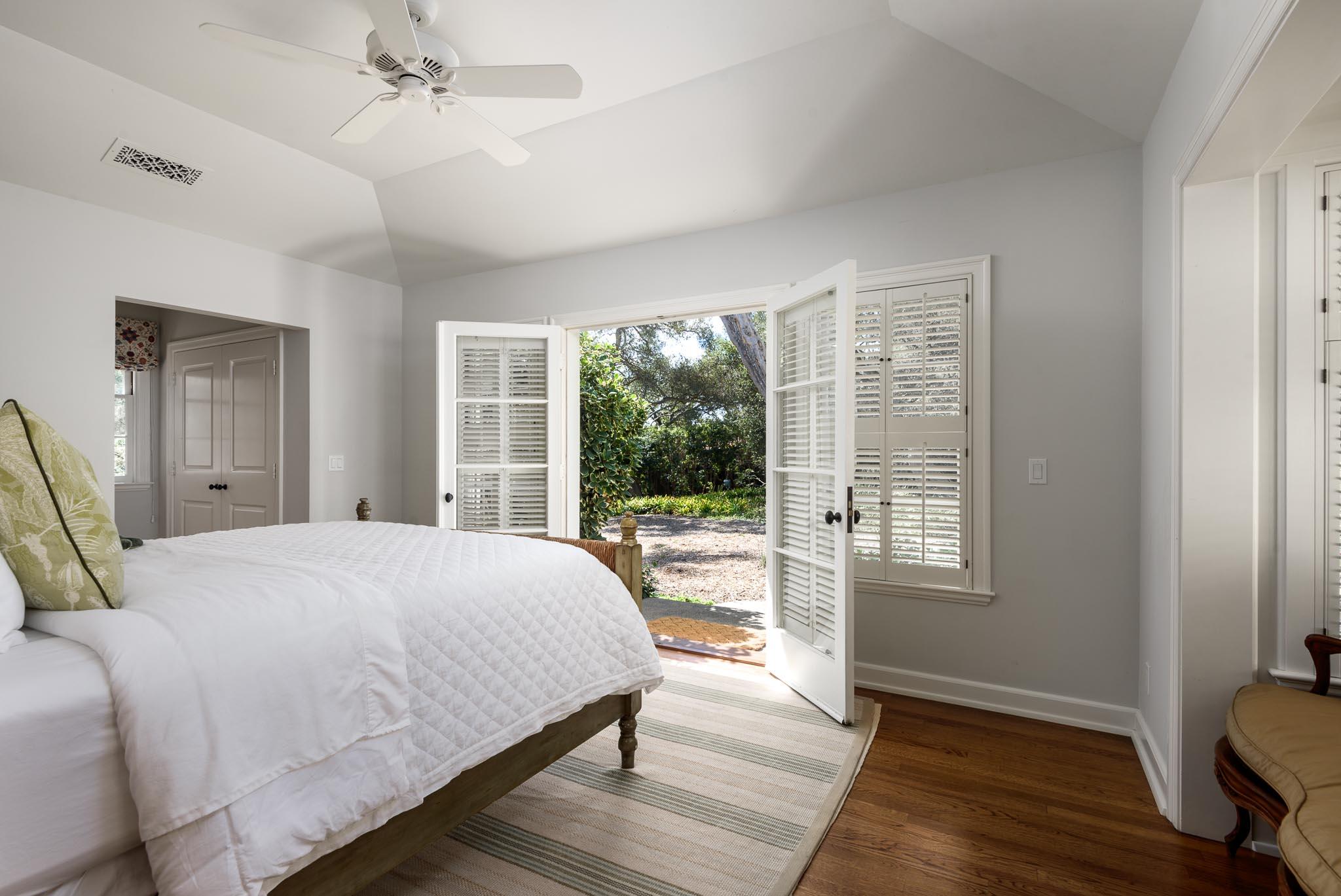 645-675 Olive Road Montecito, CA 93108 - Photo 16 of 34 a bedroom with a bed wooden floor and window
