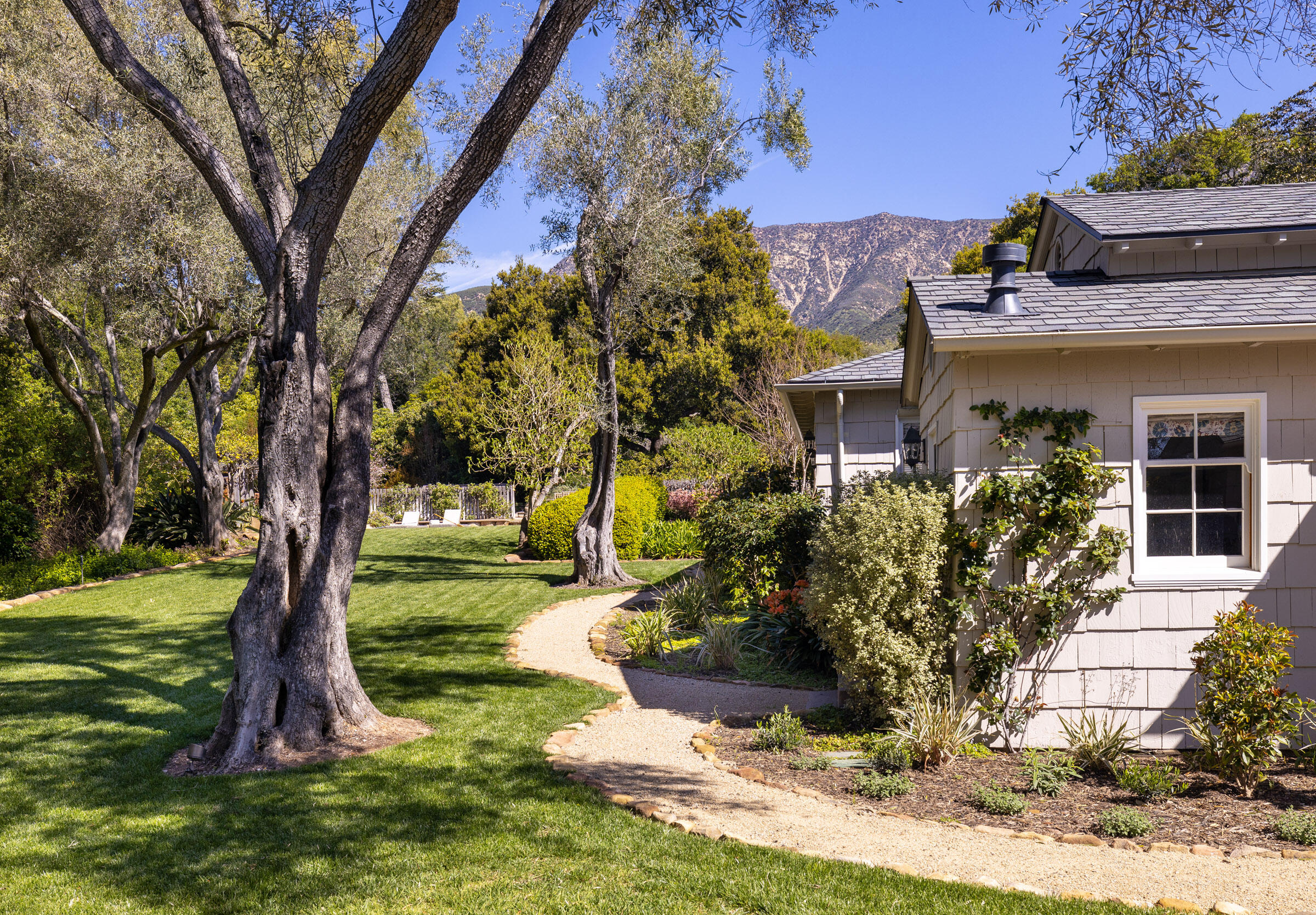 645-675 Olive Road Montecito, CA 93108 - Photo 21 of 34 a front view of a house with a yard